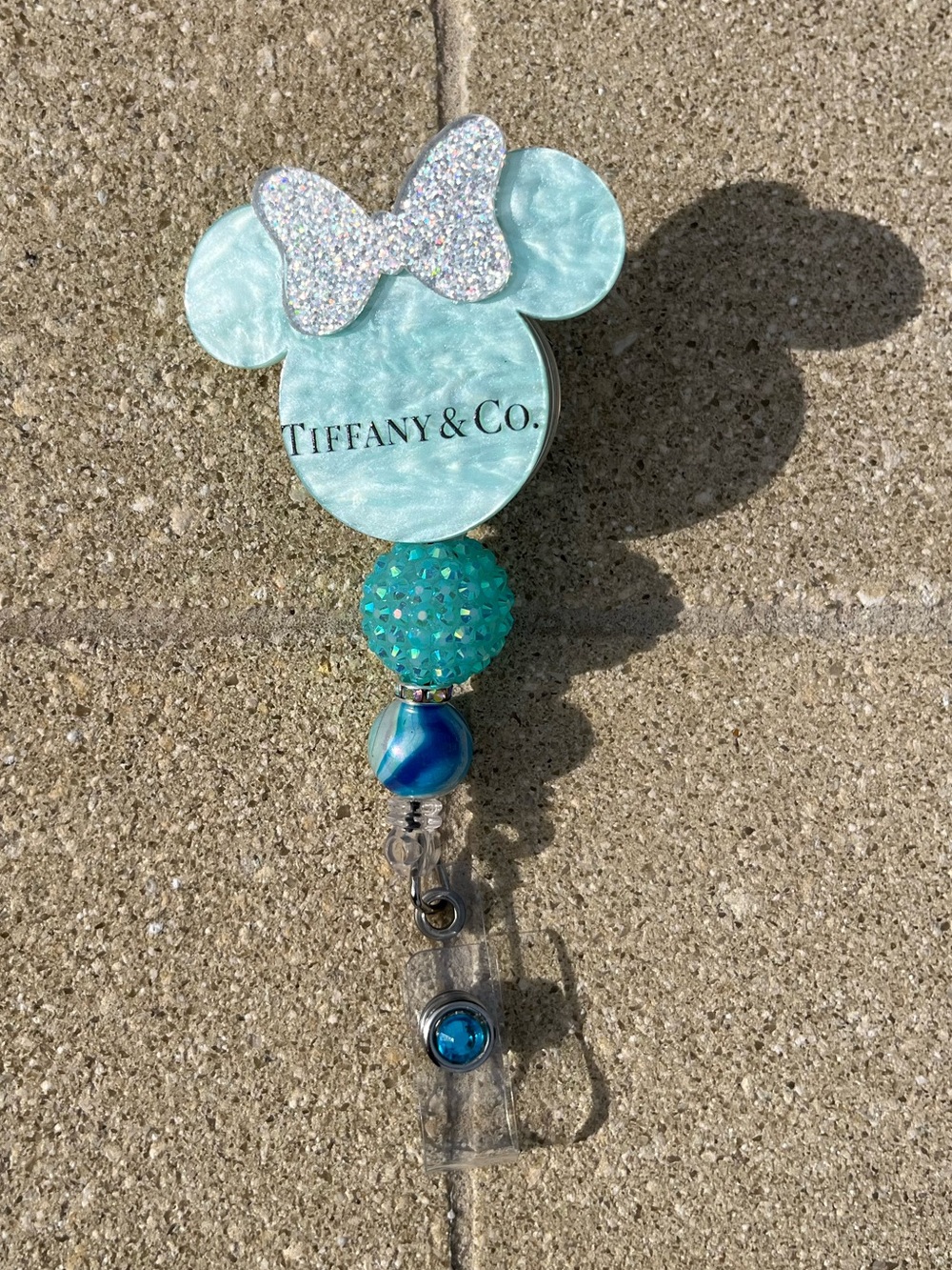 Hand Crafted Inspired Turquoise Character Badge Reel with Sparkle Bow